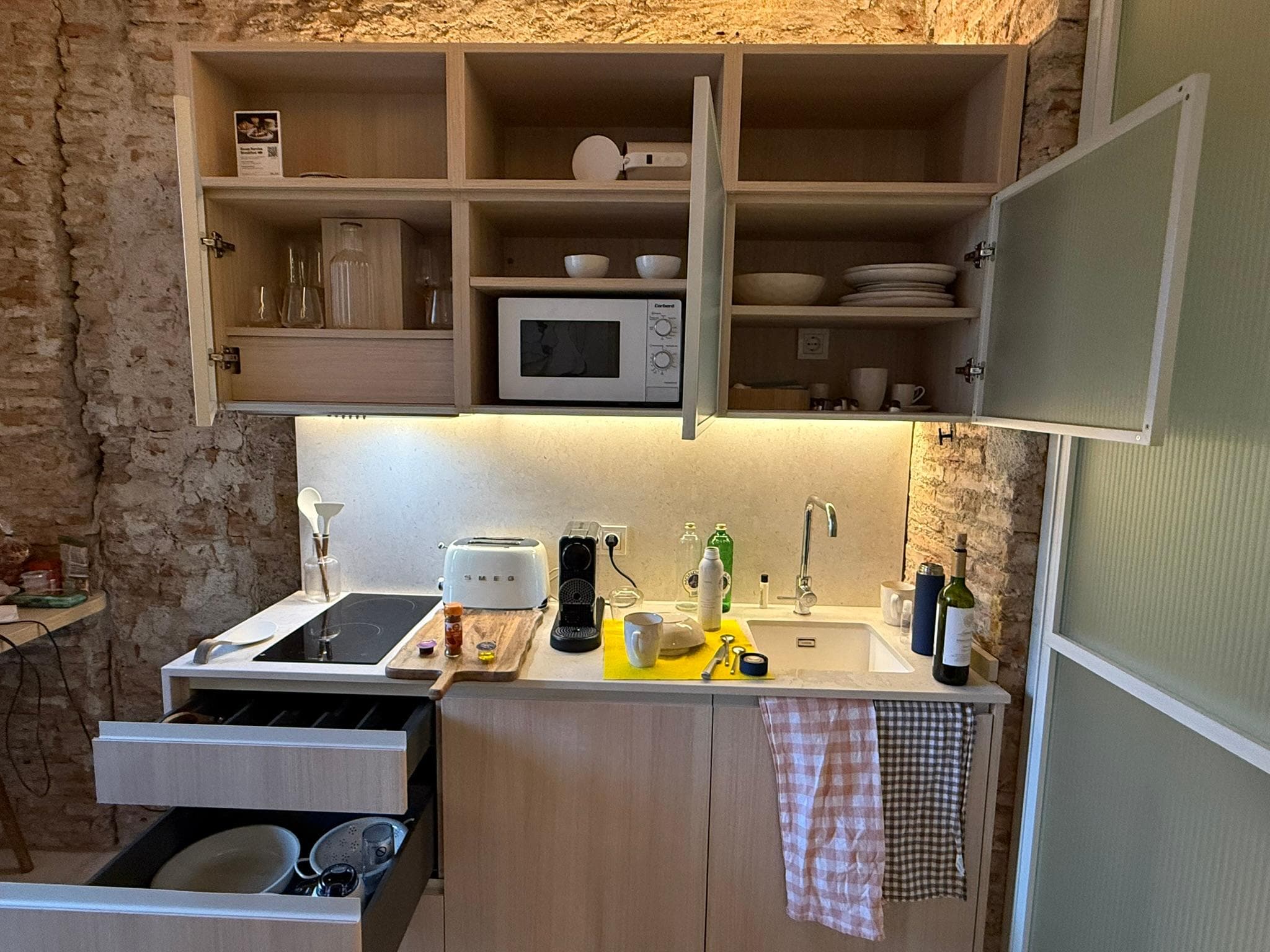 Fully furnished kitchenette with everything you need to prepare your own meals.