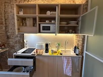 Fully furnished kitchenette with everything you need to prepare your own meals.