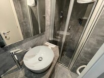 Vanity and shower, to get in shower you have to close the bathroom door