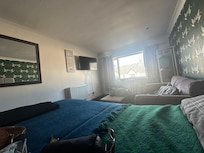 Comfy bed, sofa, table, hanging space, TV