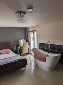 Bedroom and huge bath. Toilet , basin and shower off of bedroom