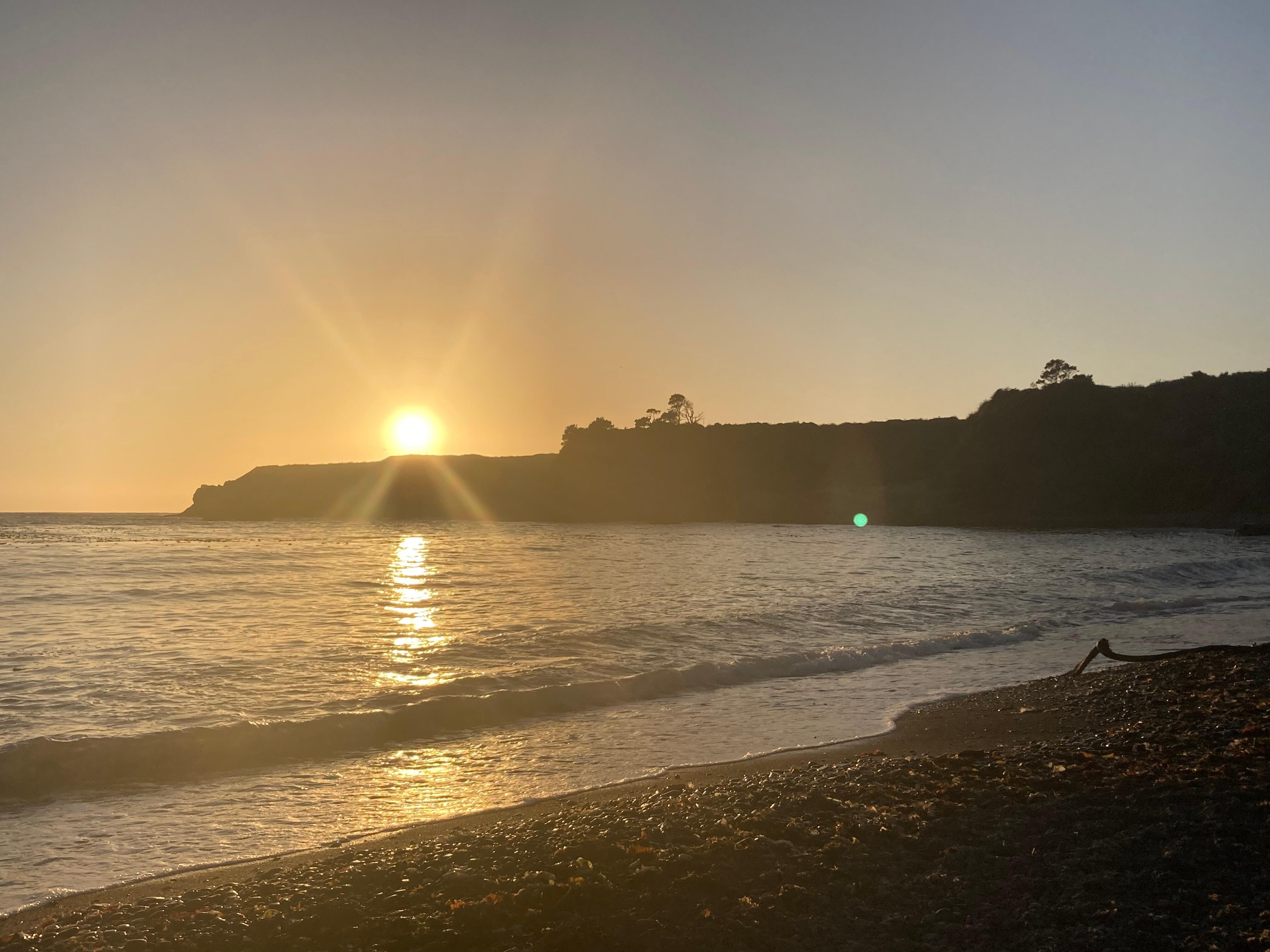 Sunset from beach at end of Noyo Harbor