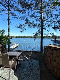 Lower level deck area with a fire table