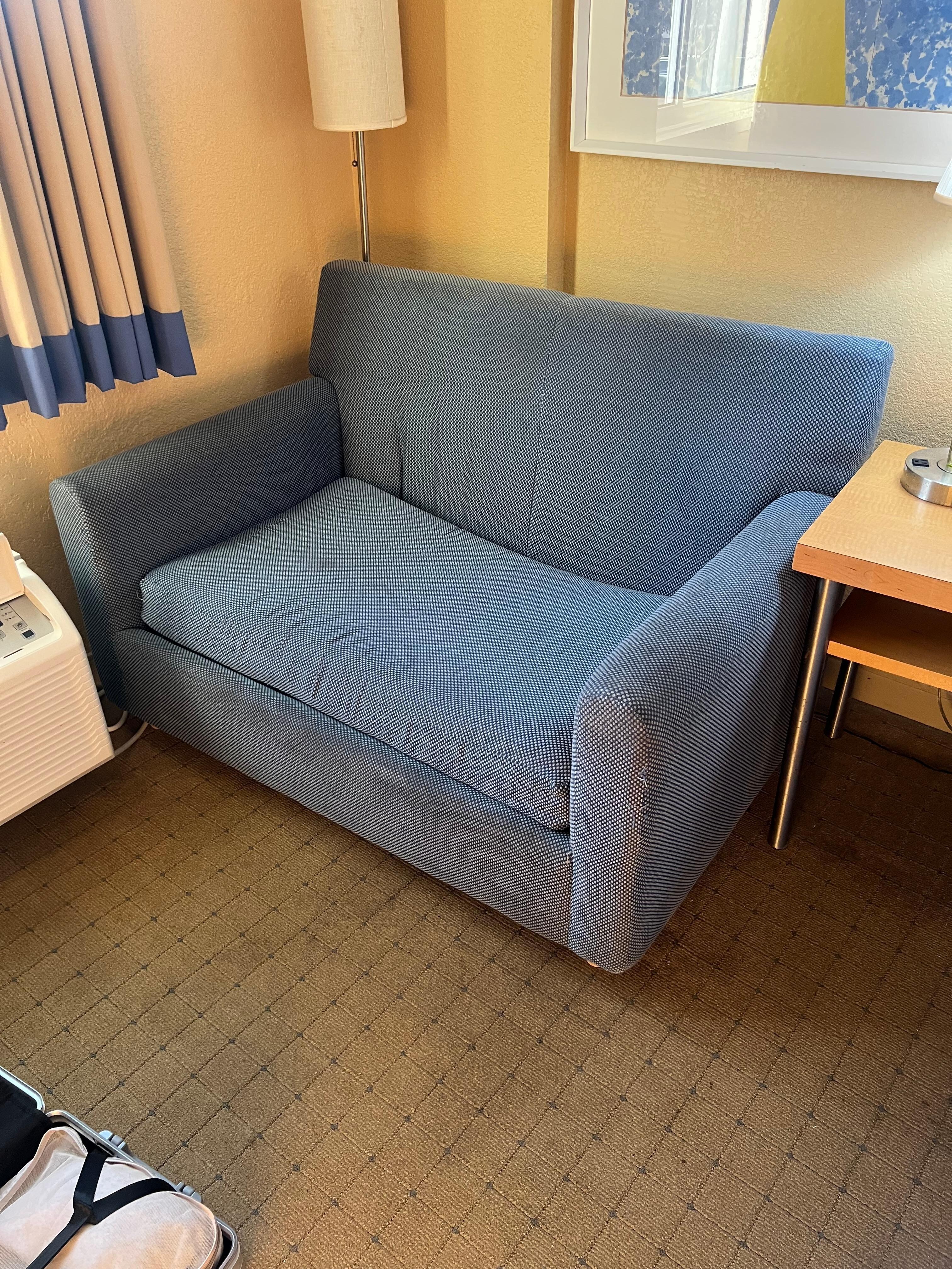 Worn and dirty couch 