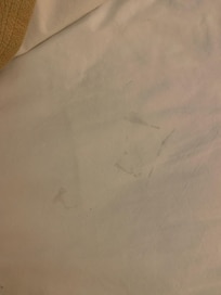 Bed sheets were stained.
