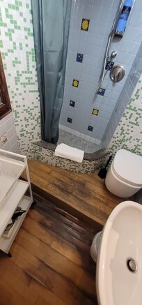 Floor peeling up/loose due to water damage.