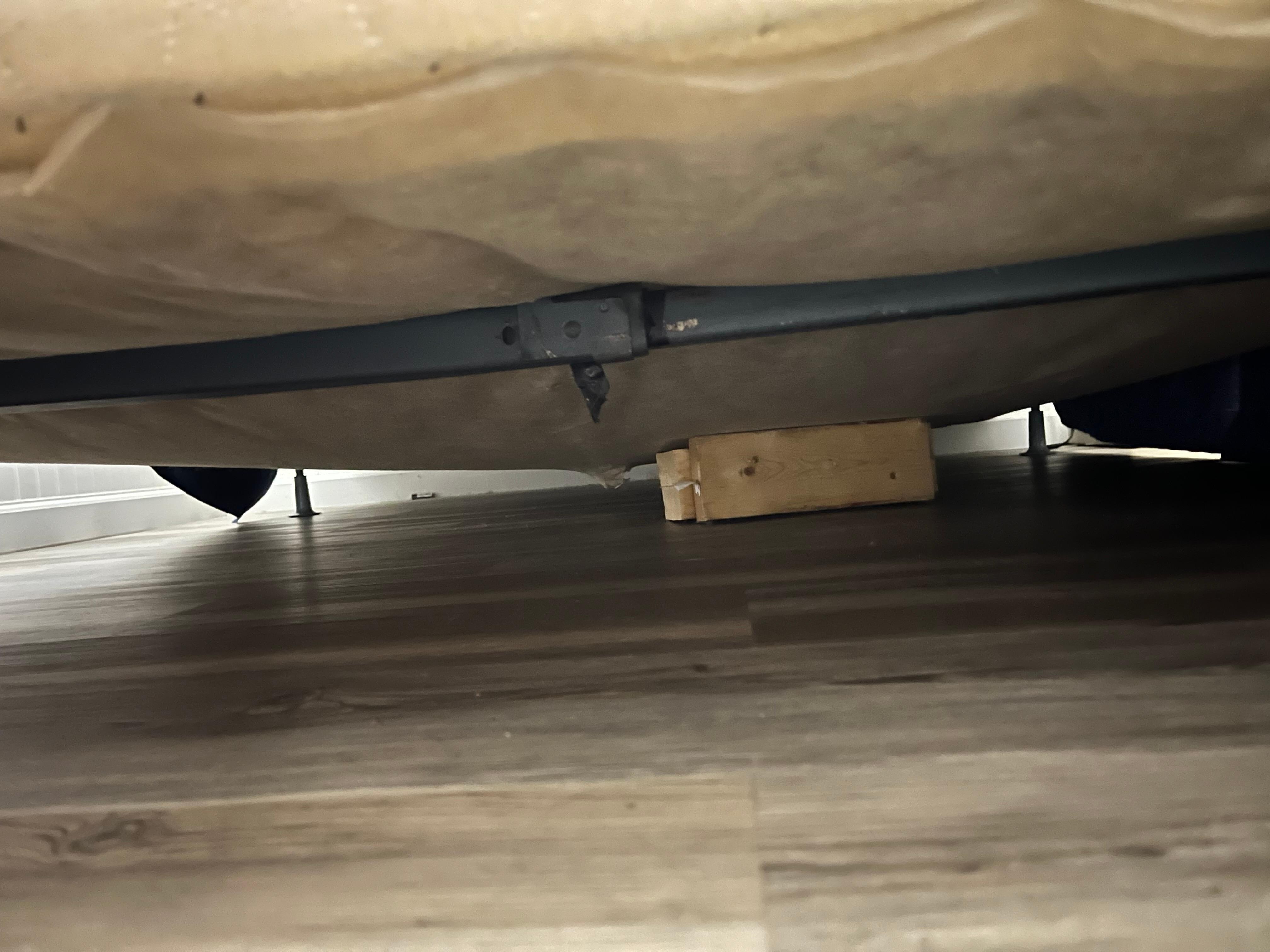 Old box spring held up with boards