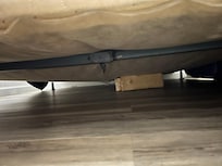 Old box spring held up with boards