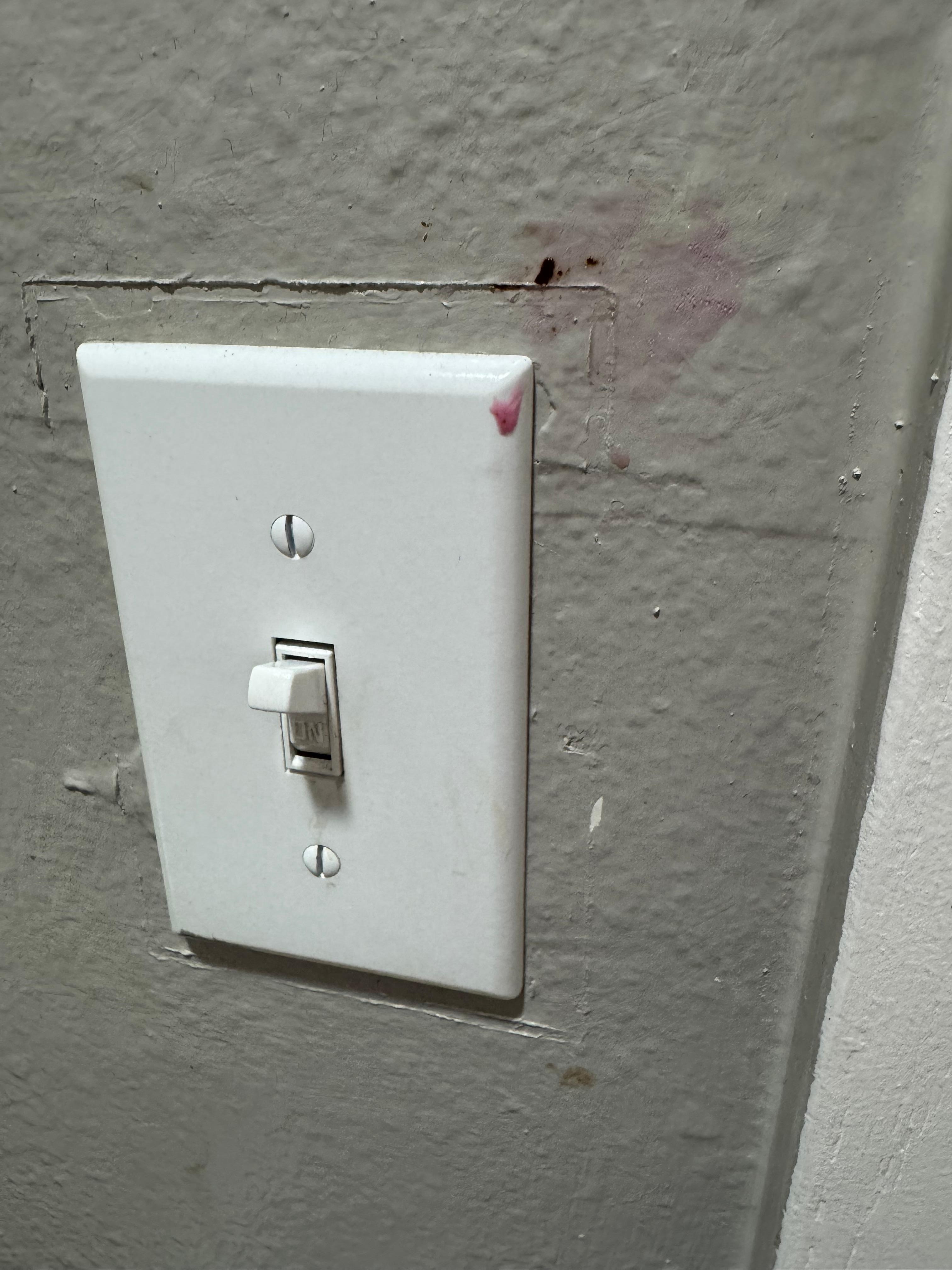Pink goop on light switch cover