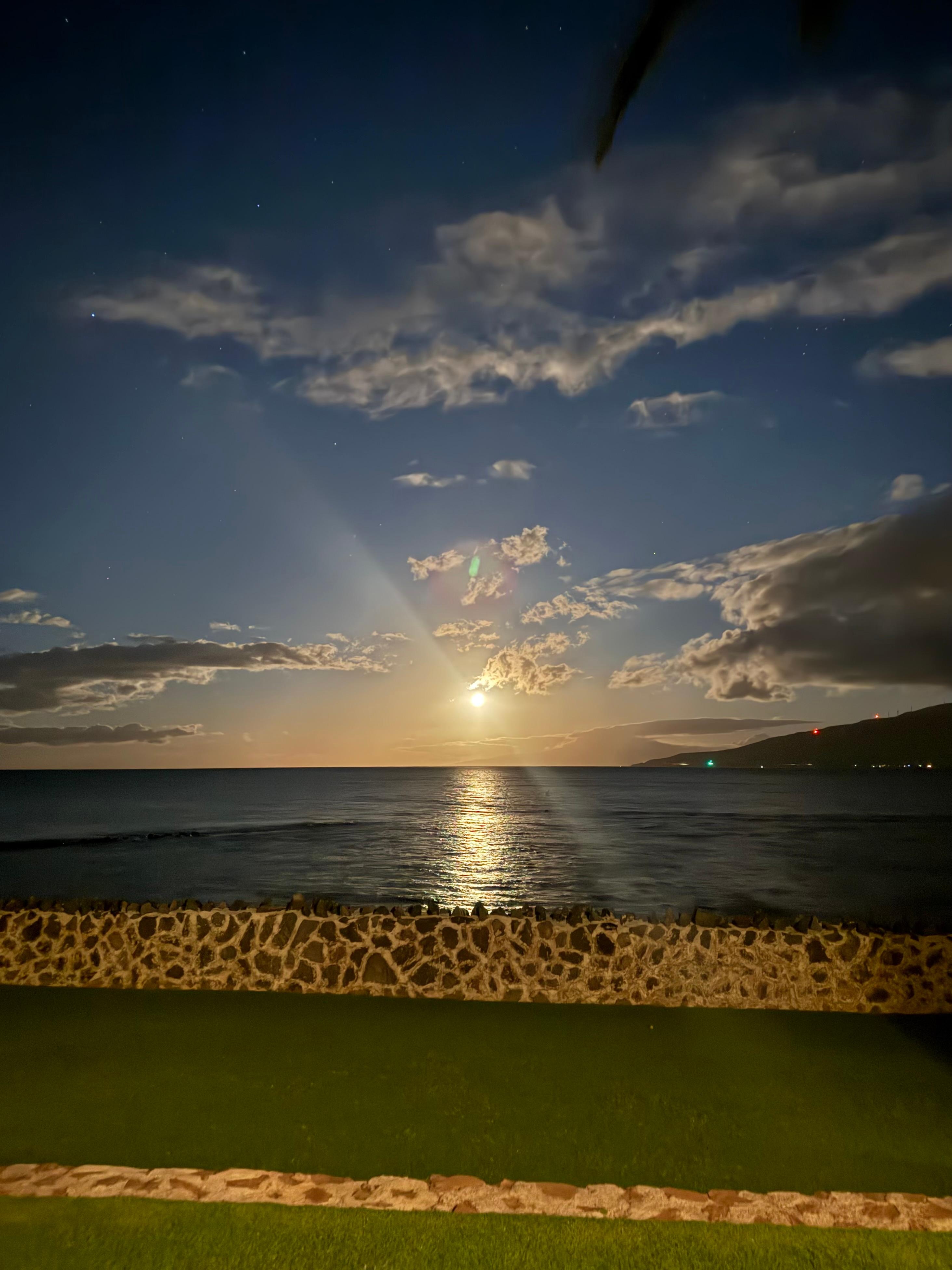 The moon setting over the horizon.