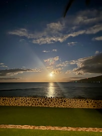 The moon setting over the horizon.