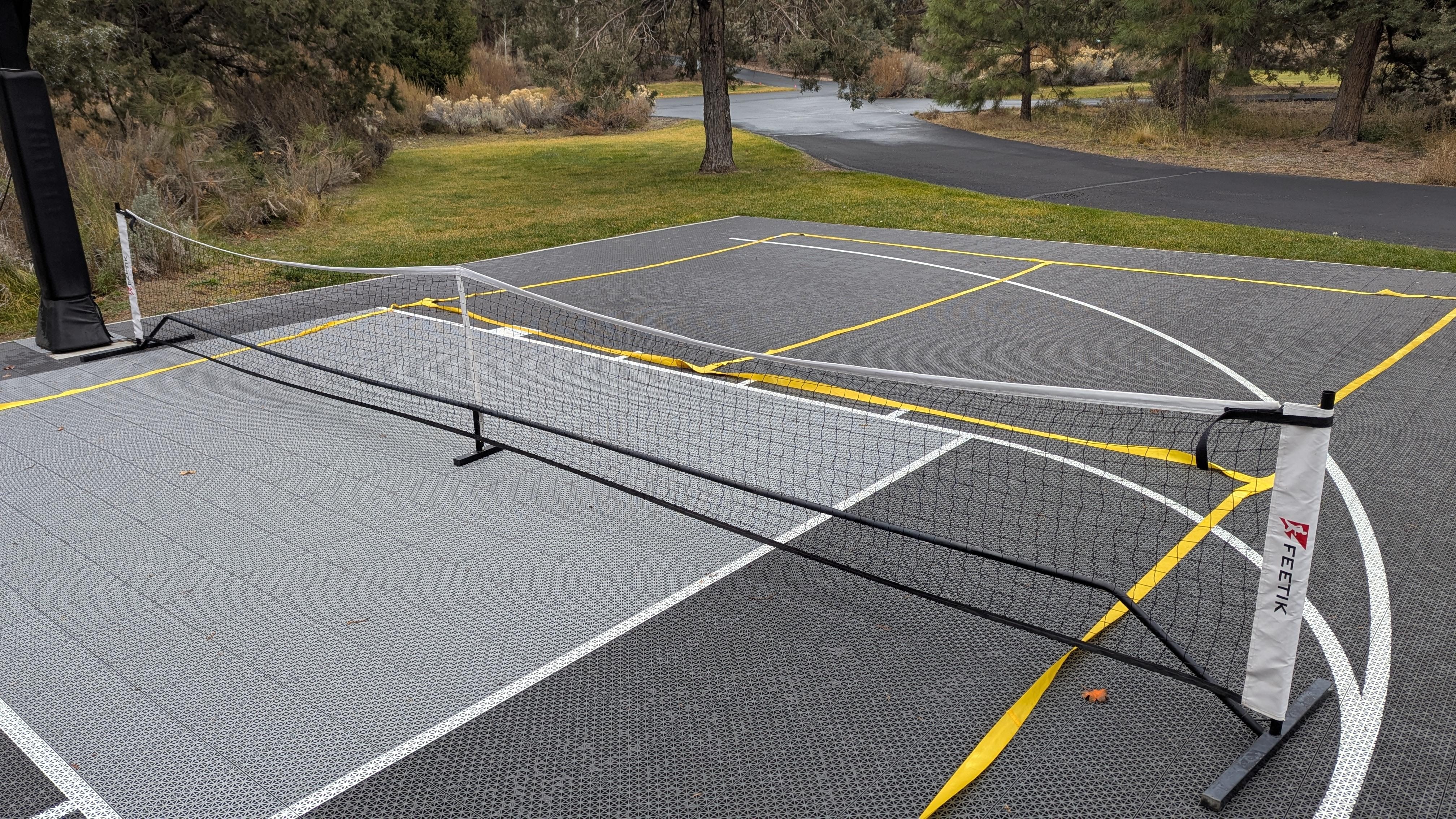 This is what the pickleball net looks like when put together. There are a lot of pieces of black pipe.