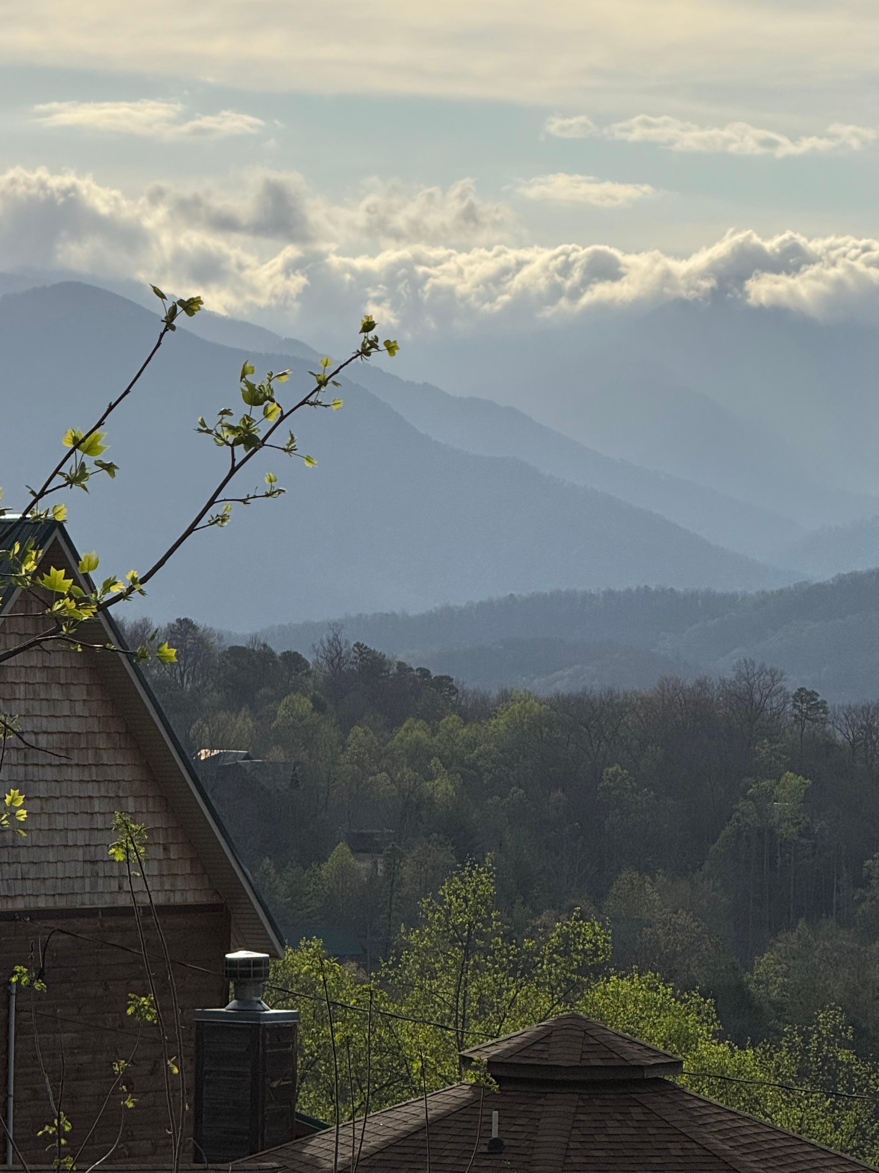 Morning clouds over mountains view from deck