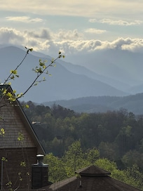 Morning clouds over mountains view from deck