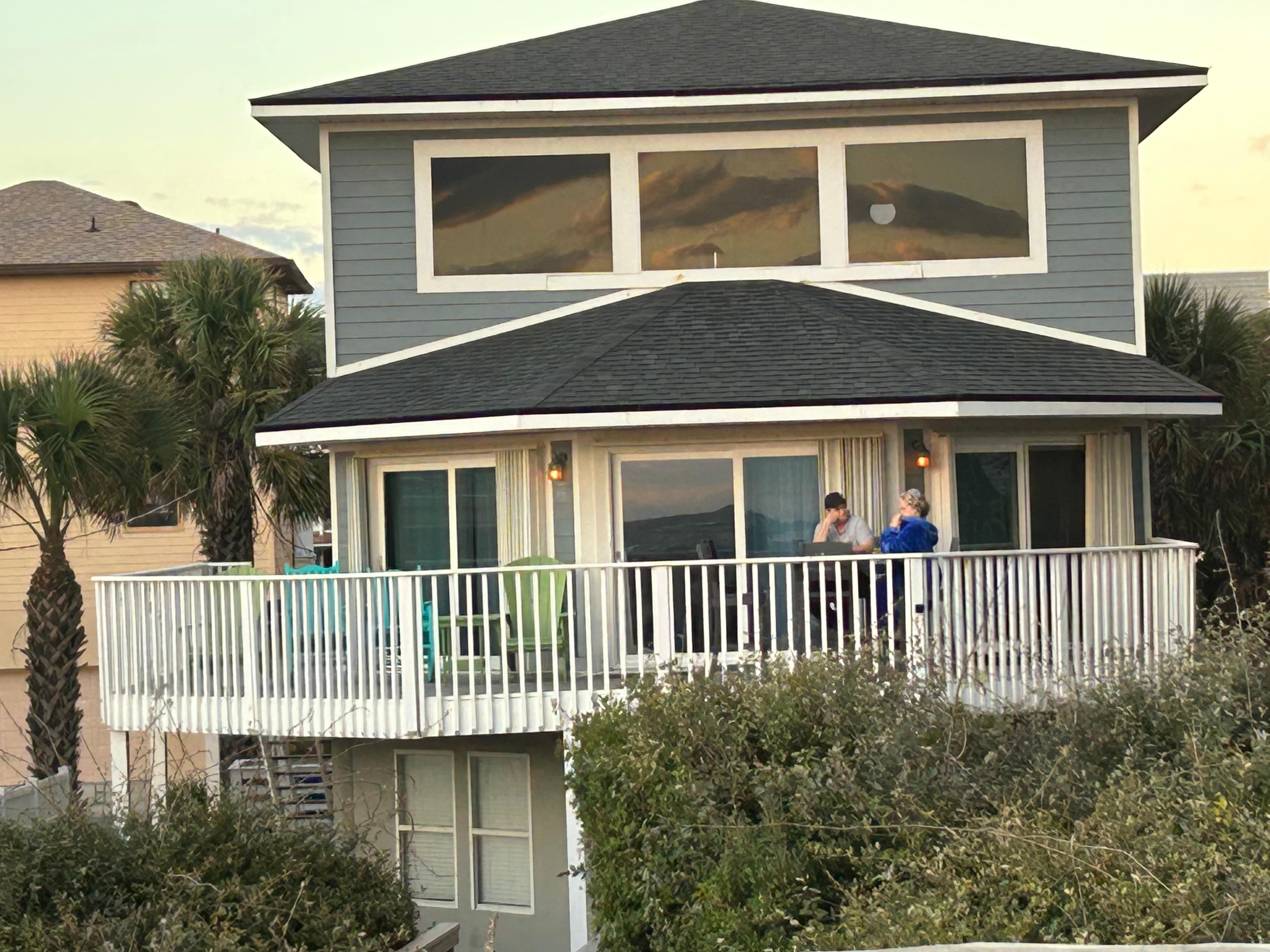 House from top of sand dune zoomed in