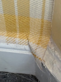 Wall paper behind bed acting as a dust trap