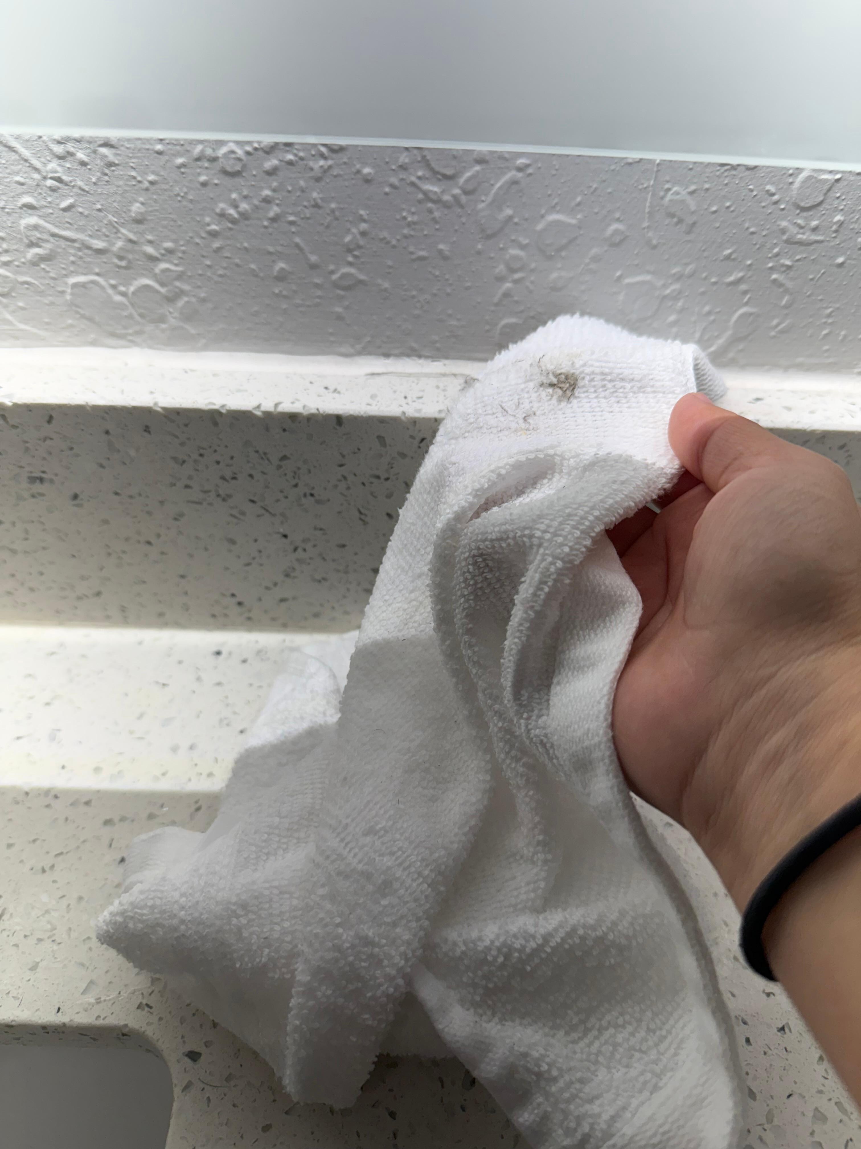 Wiped the boards under mirrors in bathroom and it was gross