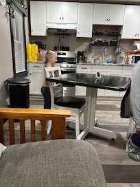 Trying to get my grandsons coat and shirt back on so we could go to dinner. He loved it there so much he didn’t want to go. Lol