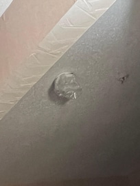 Smoke alarm covered in plastic