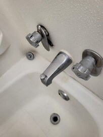Hair in tub, faucet loose