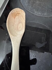 The wooden spoon is half broken for guests to use