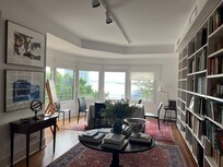 Front room overlooking street and water