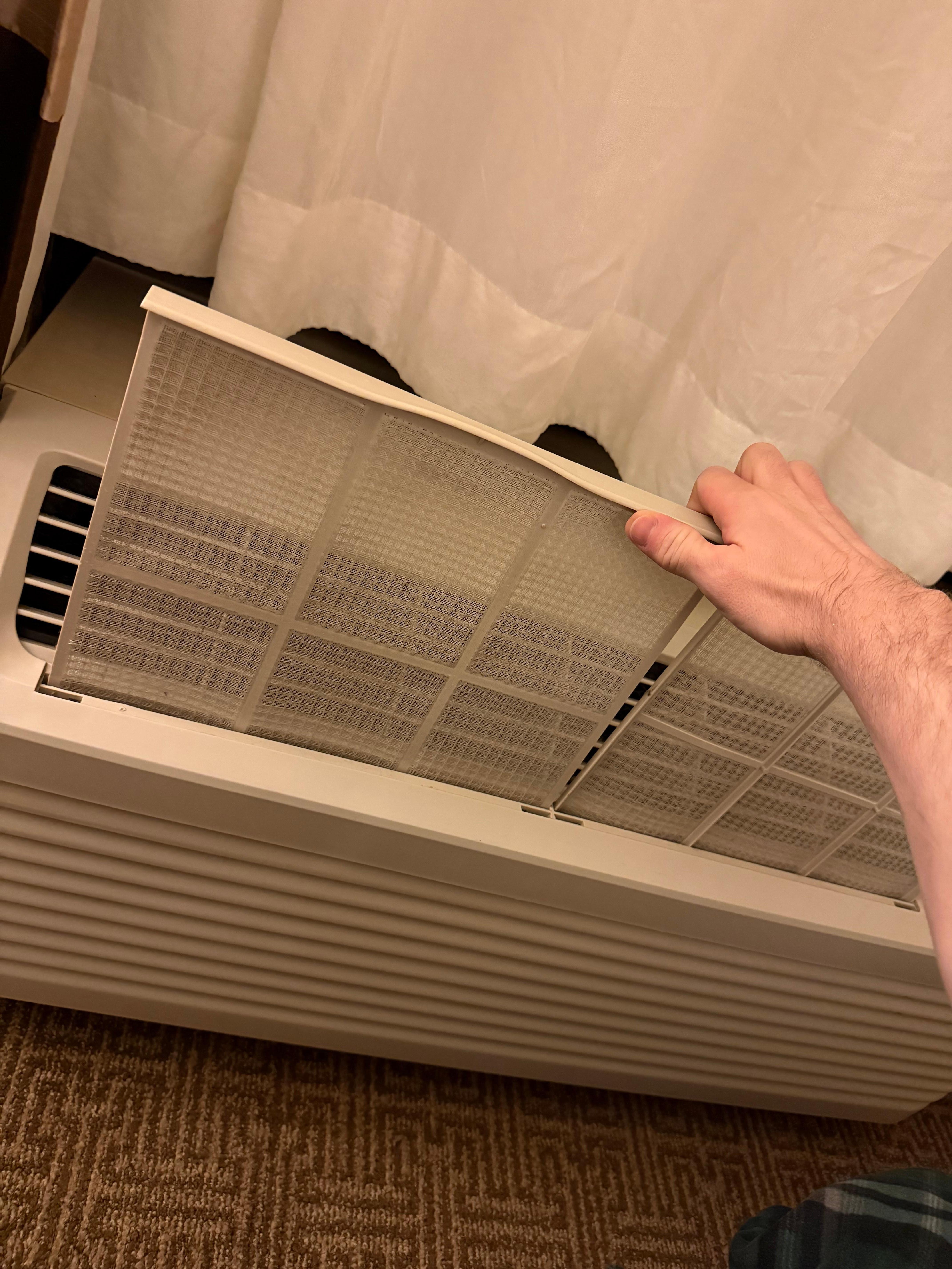 CLEANED FILTERS BEING PUT BACK INTO THE UNIT