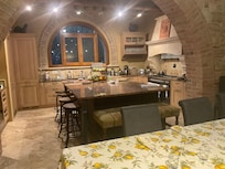 Kitchen and adjoining dining area can accommodate ten.