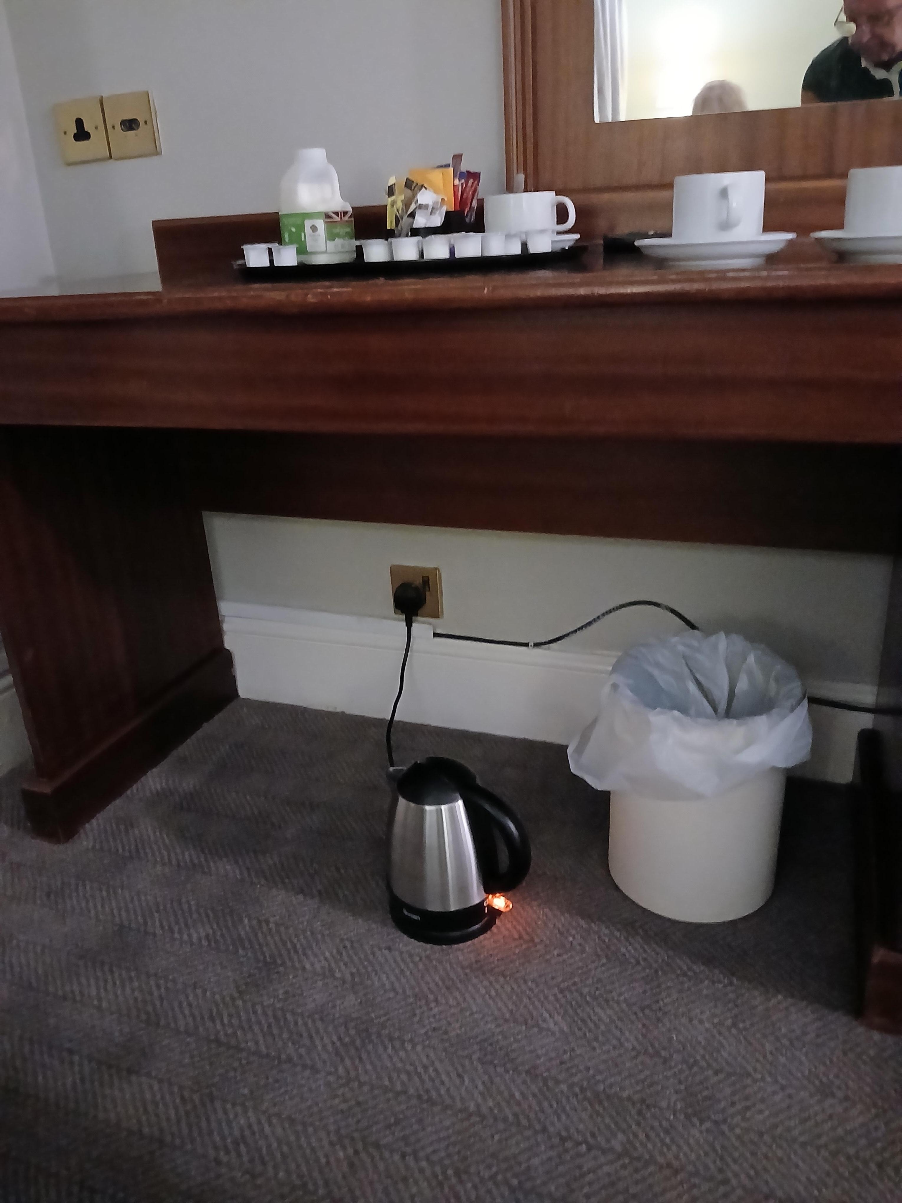Only plug for kettle under desk. A safety hazard as it's a family room!!