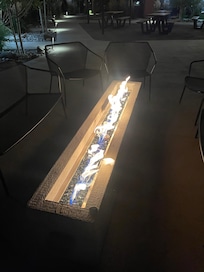 Outdoor fireplace in common area.