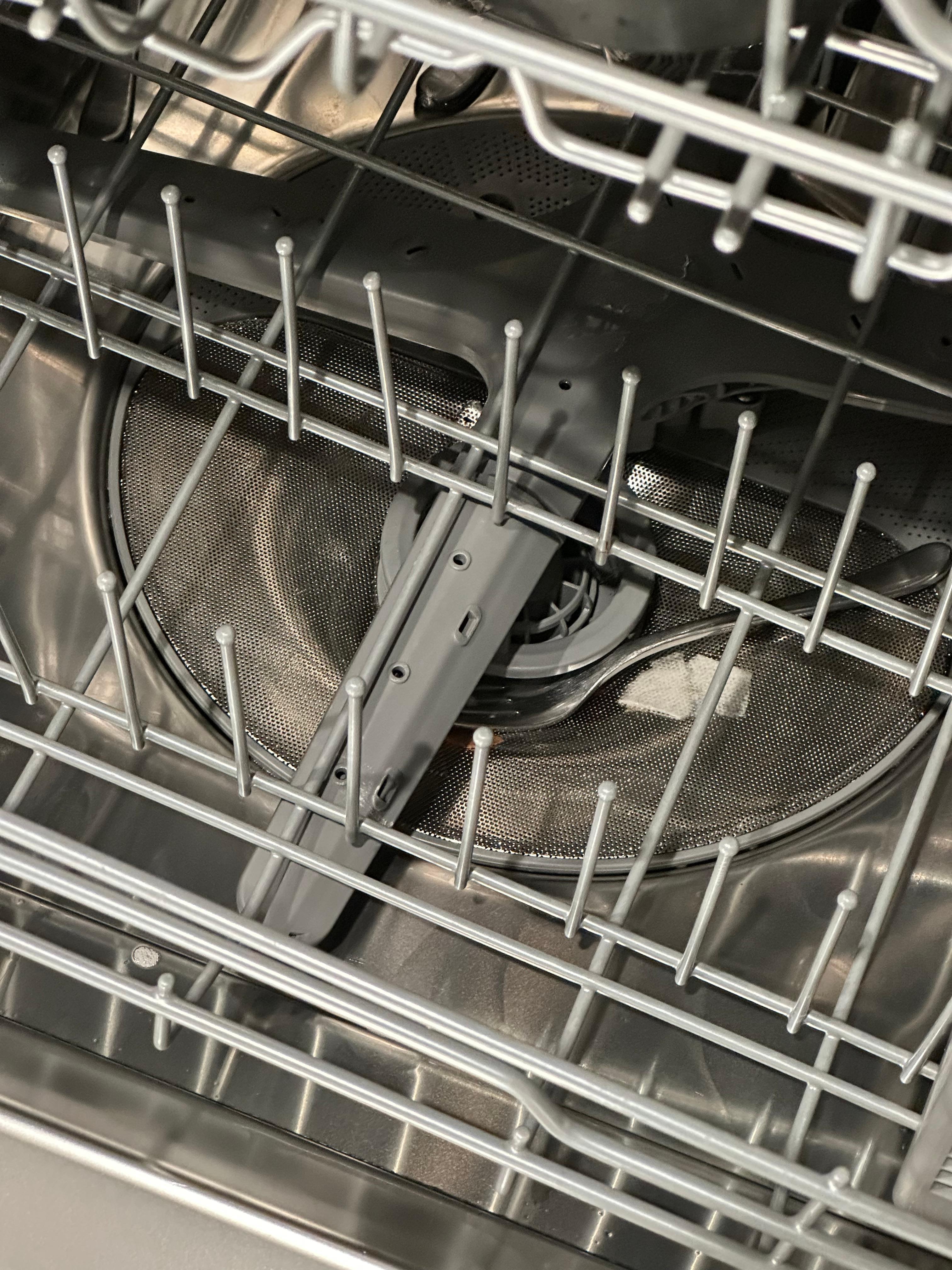 Dishwasher with food and forks