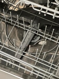 Dishwasher with food and forks