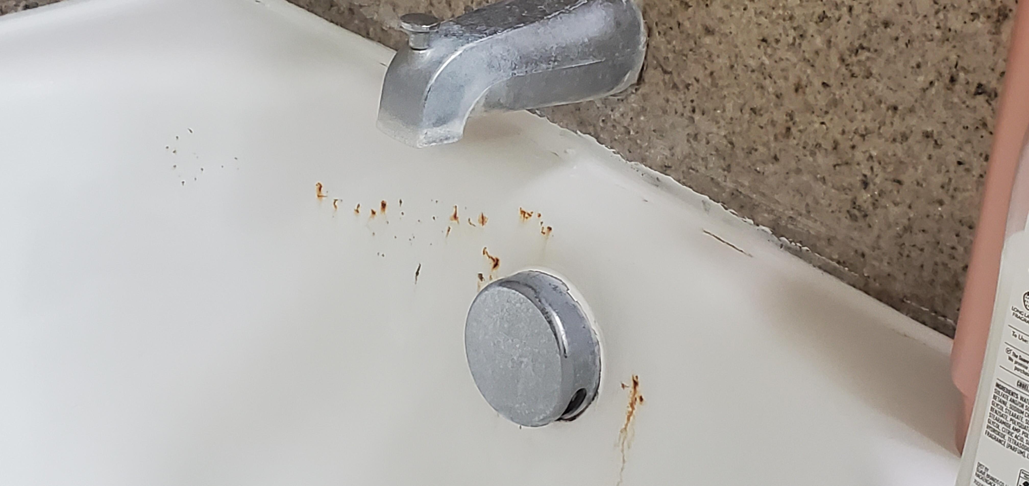 Bathtub in room that needs detail work 