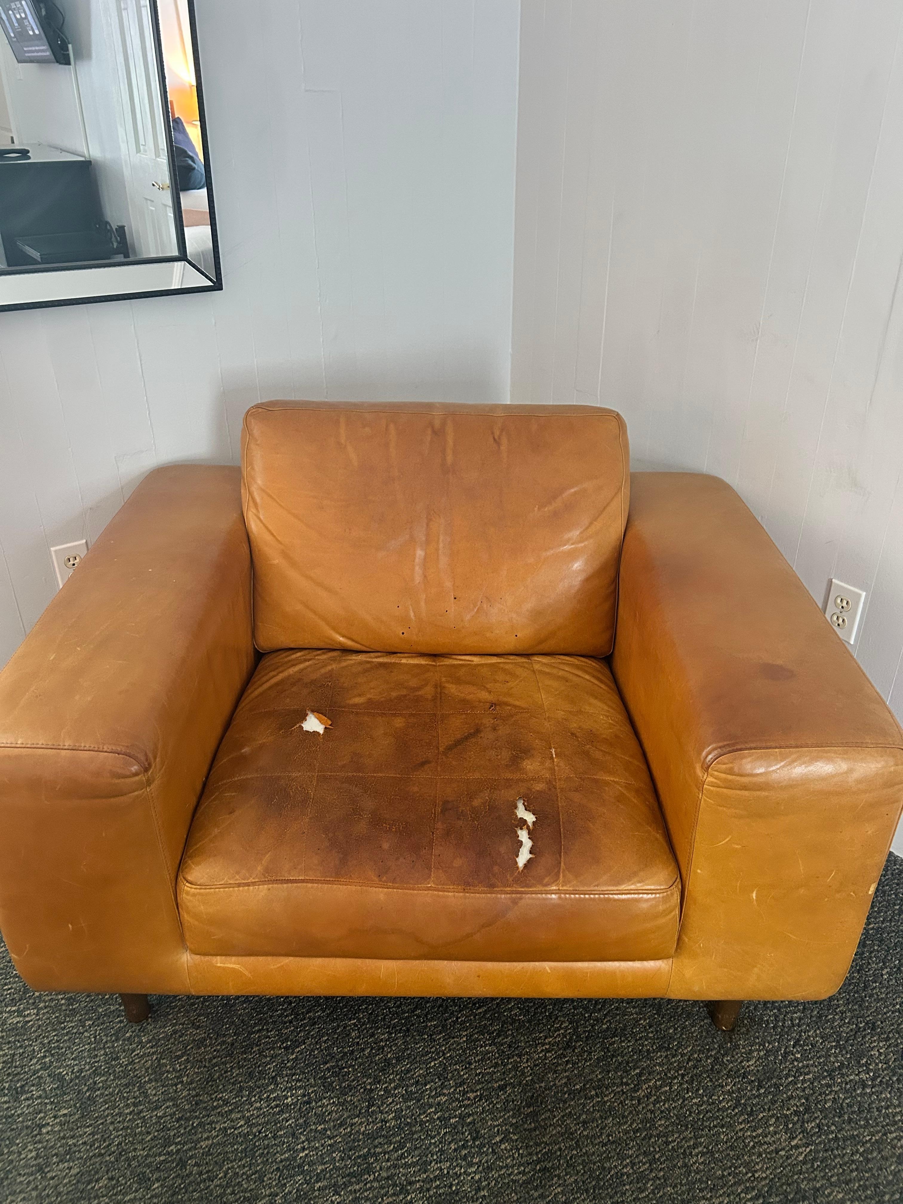 Why is this torn up and stained chair even in the room?