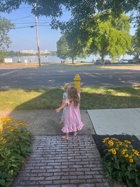 Granddaughter waving to passing cars