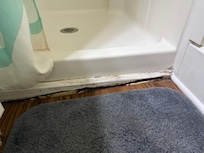 Rotten board under shower