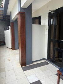 Tiny terrace next to cleaners cupboard