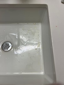 Dirty sink and countertop… yellow substance in sink