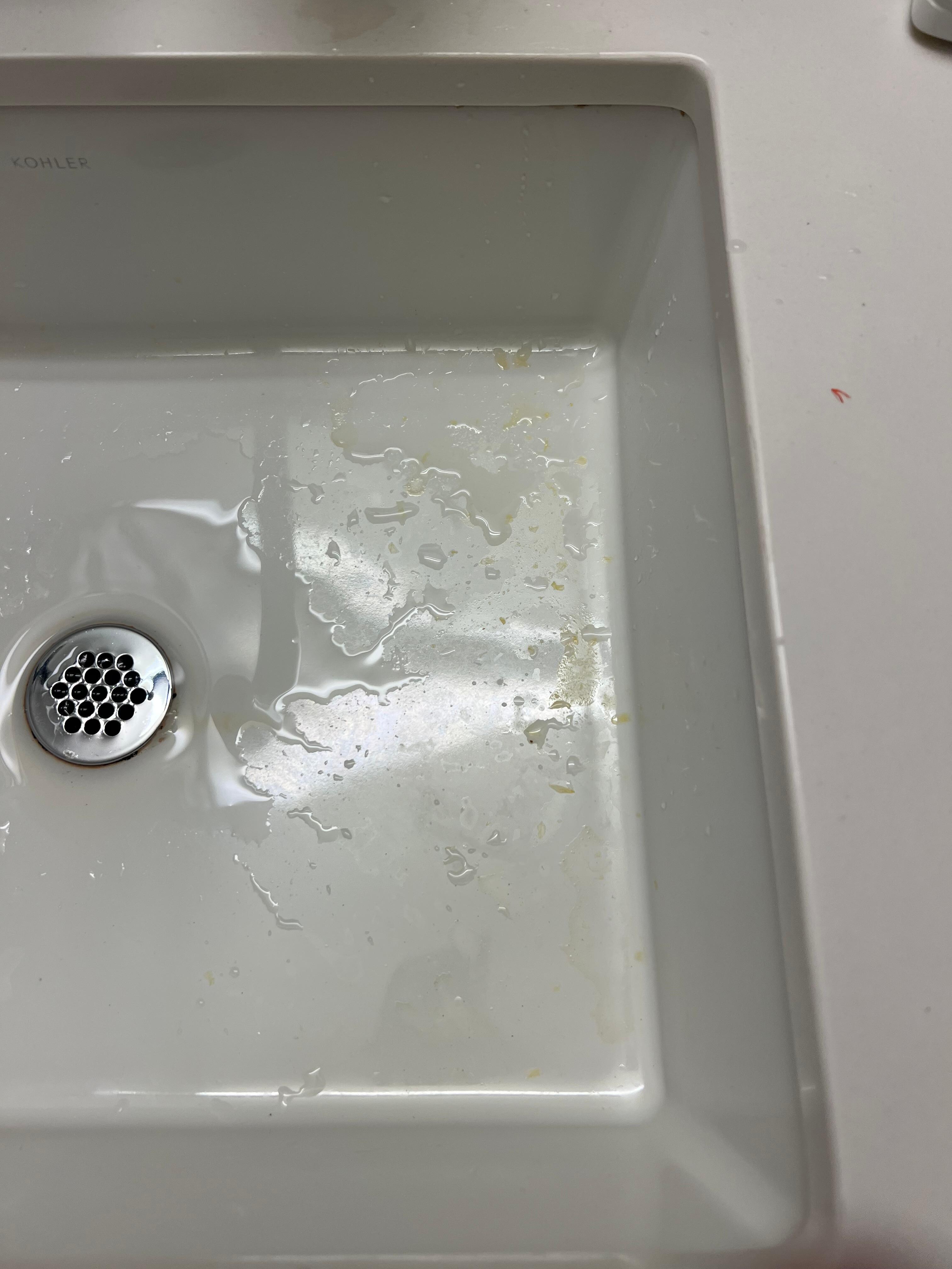 Dirty sink and countertop… yellow substance in sink