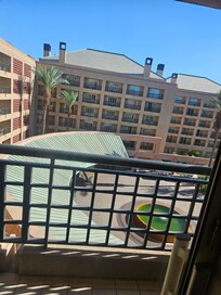 We paid for a pool view and got this from the psycho in the front desk and she threatened us and called security because we asked for a refund and to change our room.
