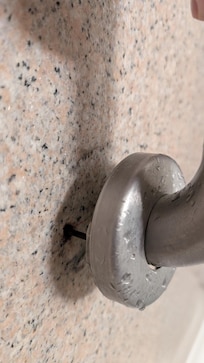 Safety shower bar pulled out from wall