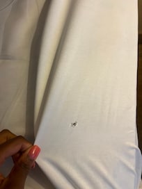 Hole in the bedsheet.