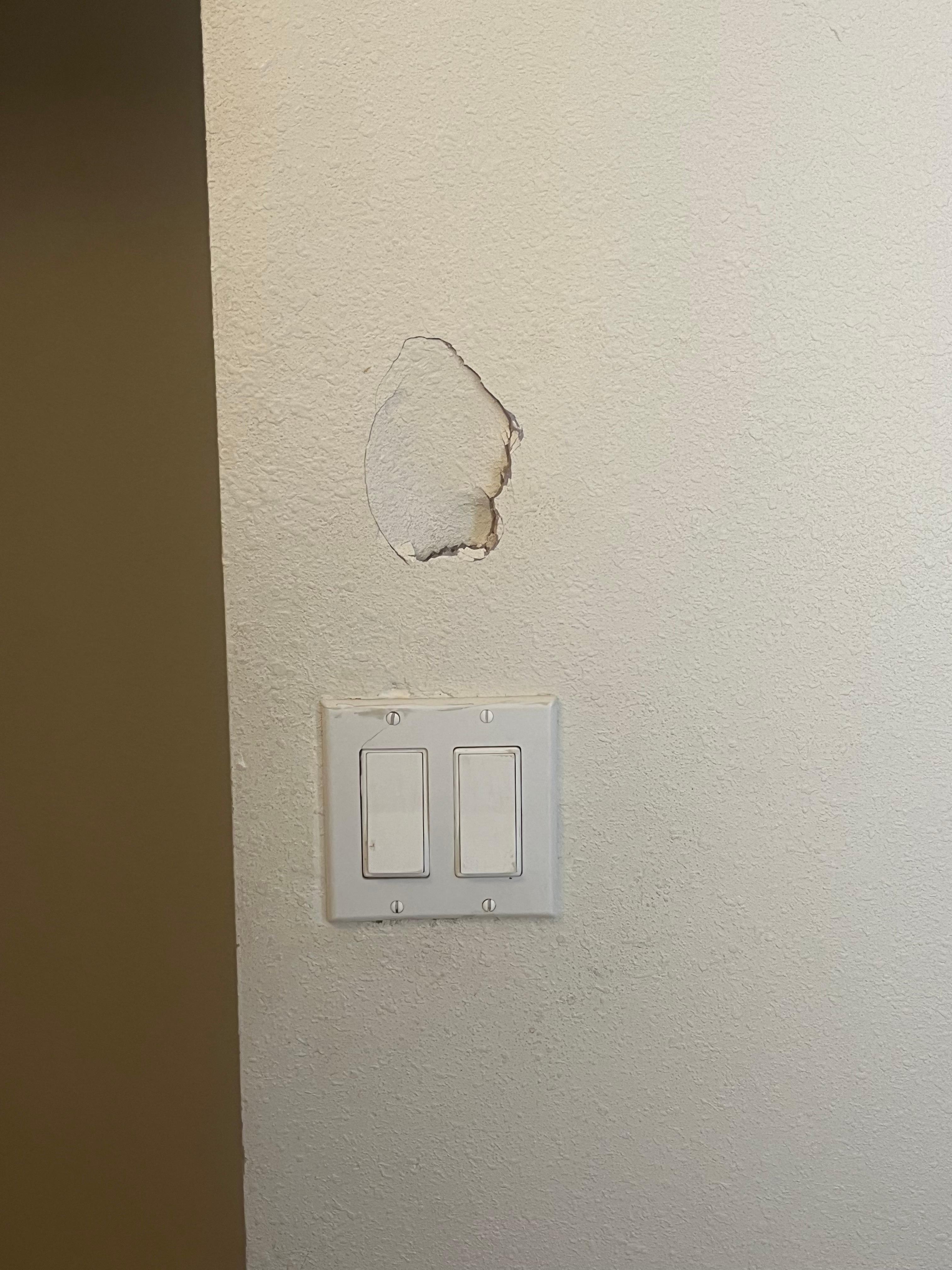 Hole in bathroom wall