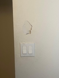 Hole in bathroom wall