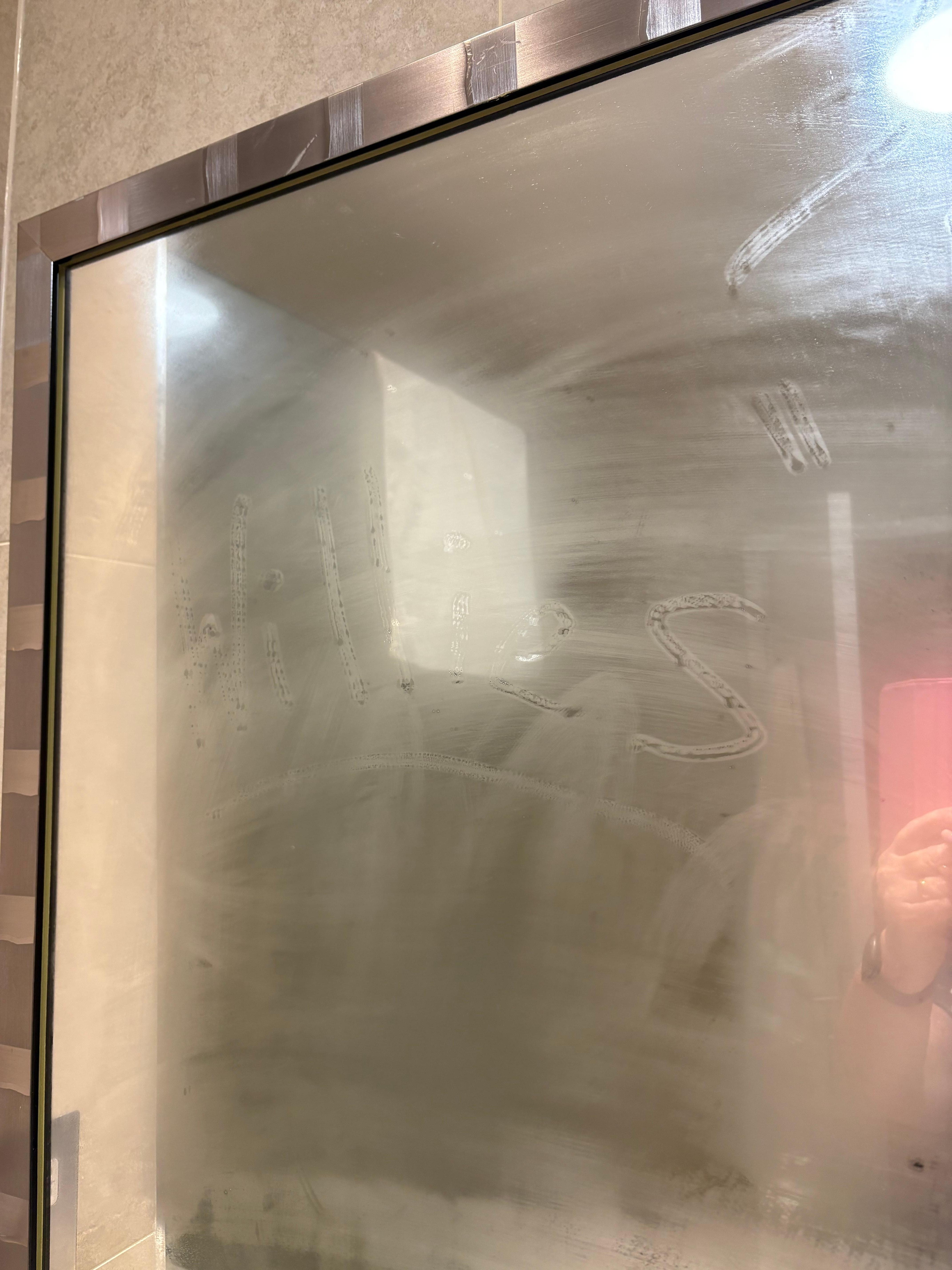 On the bathroom mirror.