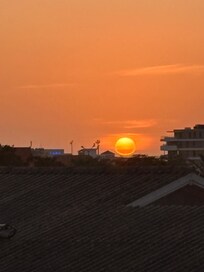 Zonsondergang vanaf balkon