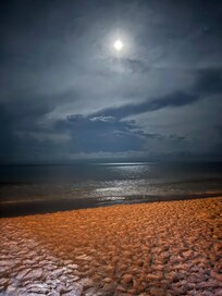 Night walk on beach in front of resort