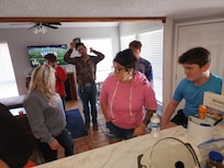 Everyone fixing their plates with Thanksgiving food