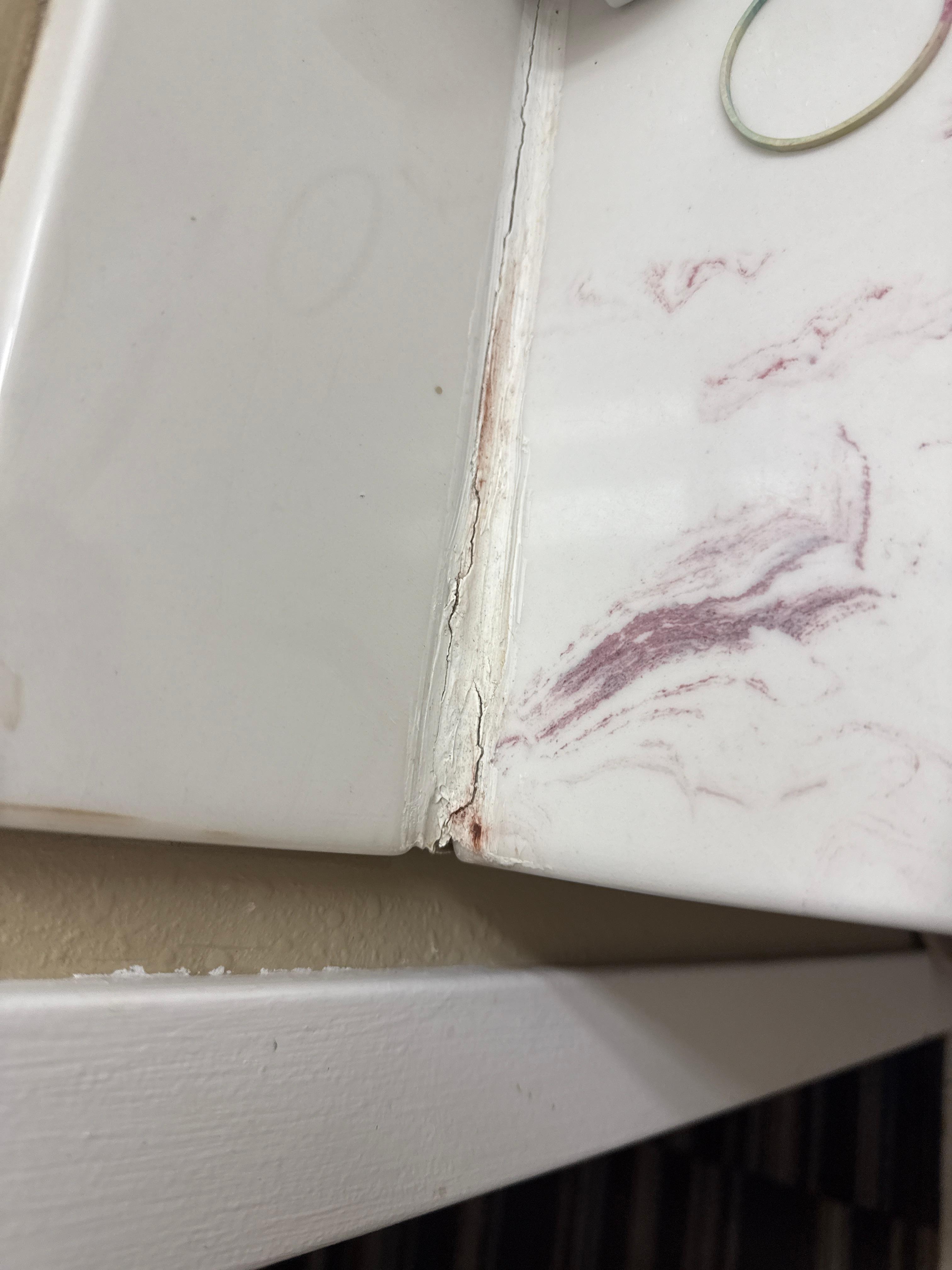 Cracked and peeling bathroom counter