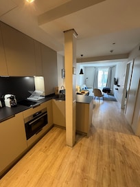 As you walk in to the apartment, the kitchen.